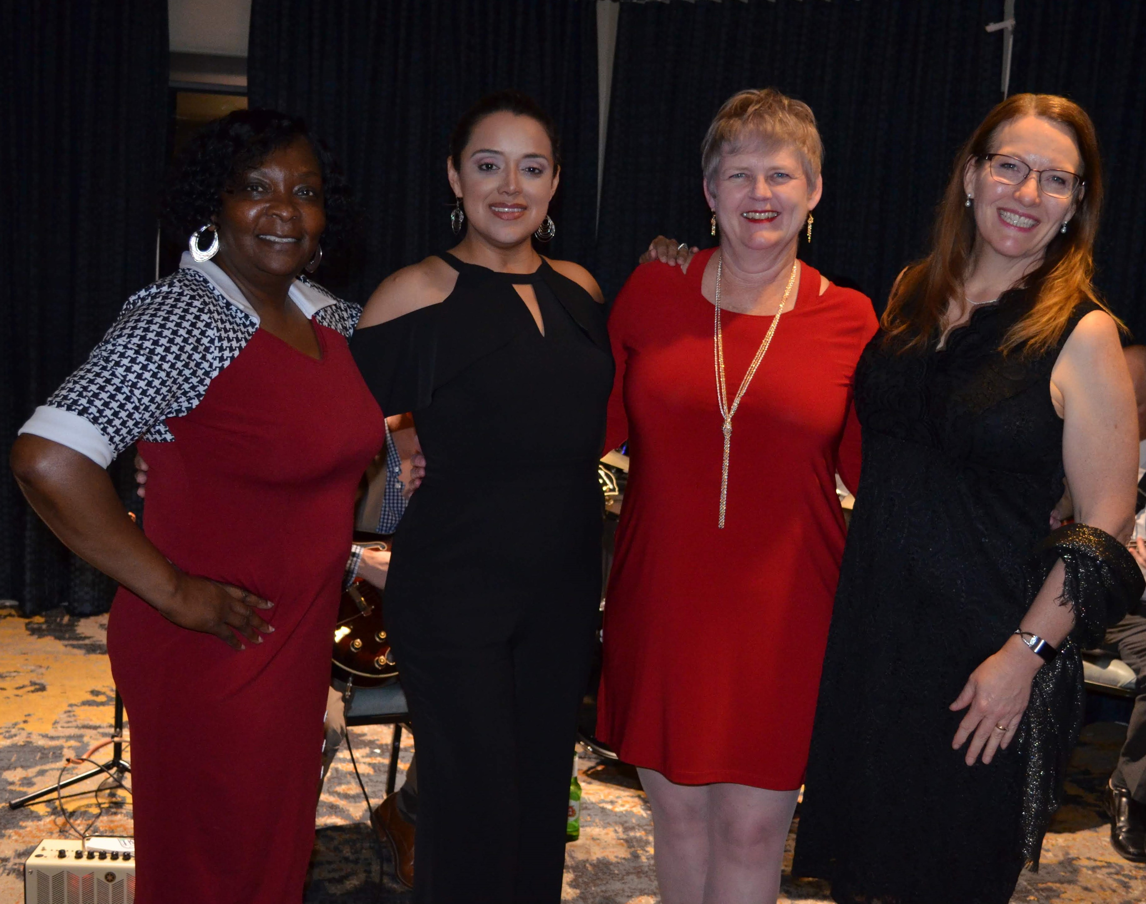 Women pose at PROUD Foundation Chef's Table Dinner 2019